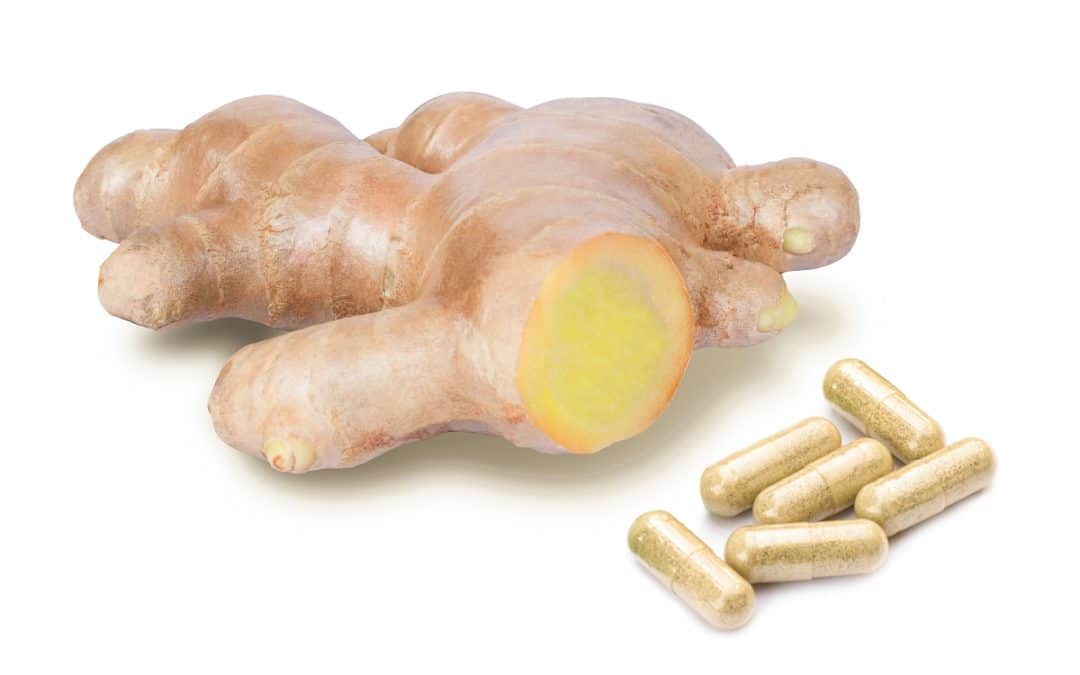 picture of ginger root with ginger capsules